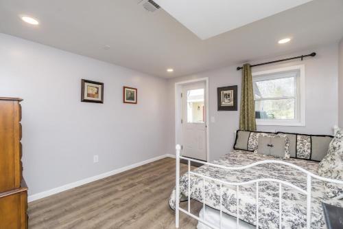 a bedroom with a bed and a window at Downtown Family Retreat - 5 Beds & 3.5 Baths in Dahlonega