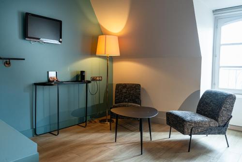 Μια τηλεόραση ή/και κέντρο ψυχαγωγίας στο Appartements de la Cité - Saint-Malo