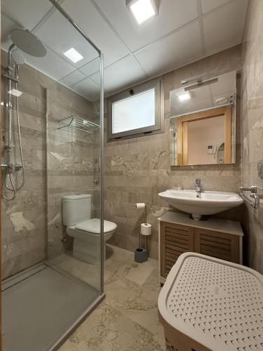 a bathroom with a shower and a toilet and a sink at F10 - Vila D Orpesa X, World Lujo - ServHouse in El Borseral