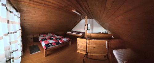 a bedroom with a bed and a sink in a room at Apartma Bogi Kranjska Gora in Kranjska Gora