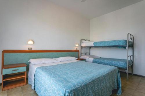 Postel nebo postele na pokoji v ubytování Hotel del Falco