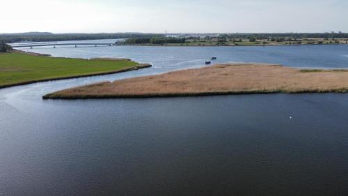 an aerial view of a body of water at Karczma Rybna Rybaczówka Marina B&B in Świnoujście