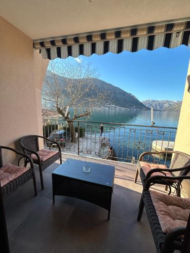 a living room with a view of the water at Apartments Dijana in Kotor