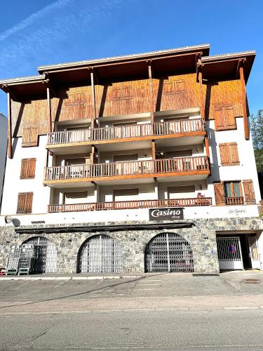 a large building with balconies on the side of it at Confort Moderne à Valberg - Terrasse avec Vue Panoramique 100 m des Pistes in Valberg