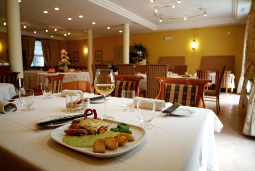 a plate of food on a table in a restaurant at Hotel Ristorante Novecento in Pegognaga