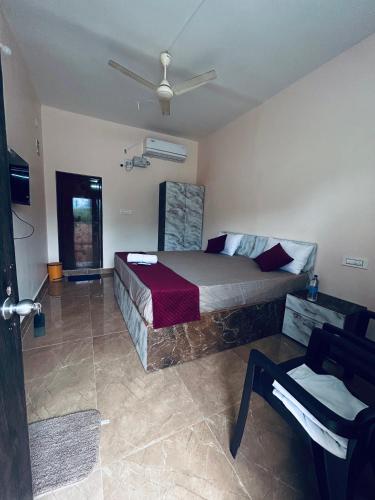 Ένα ή περισσότερα κρεβάτια σε δωμάτιο στο Anandasai residency