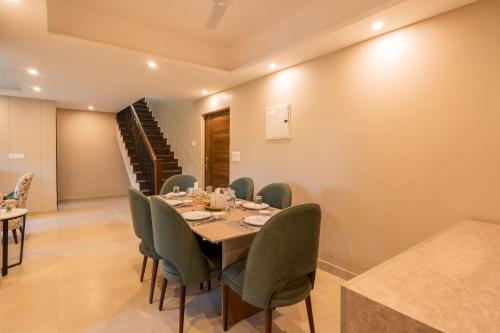 a dining room with a table and chairs at Alaya Stays 3 BHK Veera Marina Pentahouse with Pool & Lift in Candolim