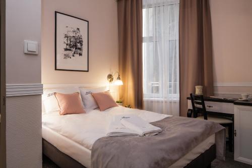 Posteľ alebo postele v izbe v ubytovaní Imagine Apartments