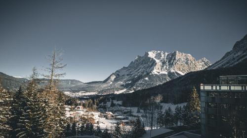 a view of a snow covered mountain from a building at DORMERO BeHo Zugspitze in Biberwier