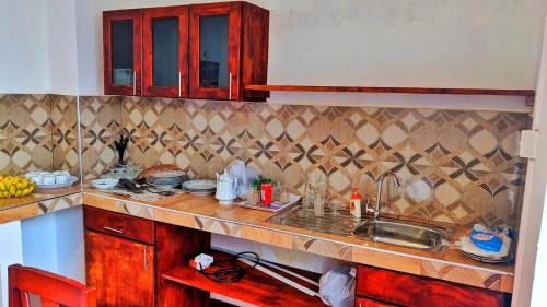 a kitchen with a sink and a counter top at Stylish Escape House-Walk to Beach Vacation Rental Hikkaduwa in Hikkaduwa