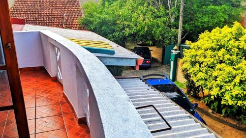 an outdoor balcony with a ramp and a roof at Stylish Escape House-Walk to Beach Vacation Rental Hikkaduwa in Hikkaduwa