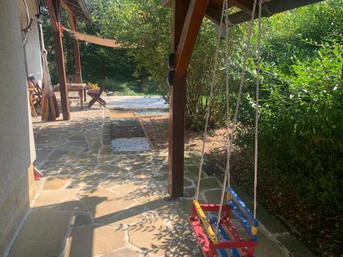 a swing in a yard with a playground at Chalupa Krompach in Krompach
