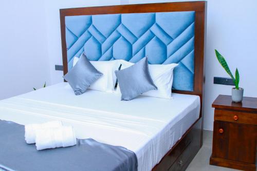 En eller flere senge i et værelse på TAffy REsort