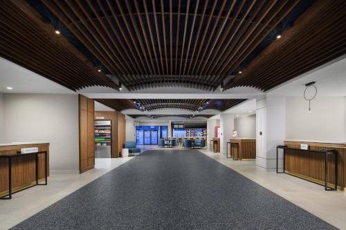an empty lobby with a large ceiling with wood at Courtyard by Marriott Orlando Lake Buena Vista at Vista Centre in Orlando