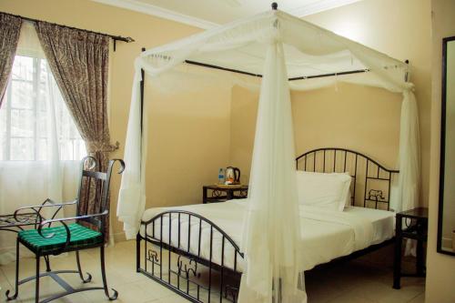 Ένα ή περισσότερα κρεβάτια σε δωμάτιο στο Zakinn Hotel Gangilonga