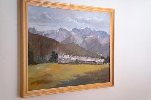 a picture of a painting on a wall at Haus Peer Burgeis in Burgusio