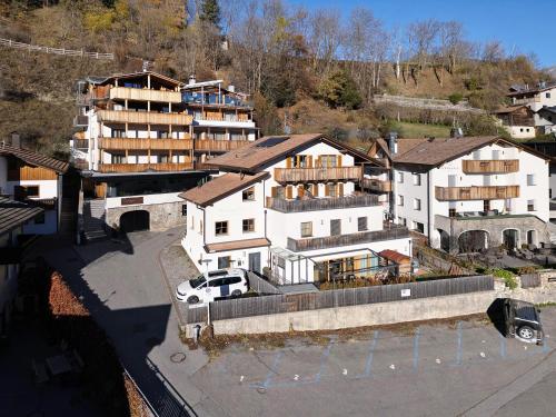 an aerial view of a building in a city at Haus Peer Burgeis in Burgusio
