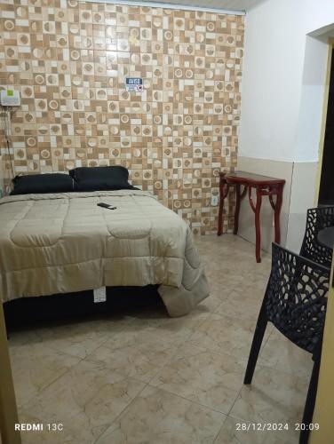 En eller flere senge i et værelse på Loft da Praia