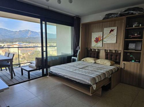 Ένα ή περισσότερα κρεβάτια σε δωμάτιο στο Studio Nautilus N7 proche centre-ville Porto-vecchio