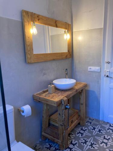 a bathroom with a sink and a mirror at Villa modernista Llafranc in Llafranc