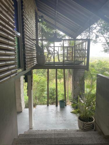 an outside view of a patio with a balcony at Shantaa in Wok Tum