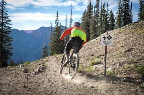 a person riding a bike on a dirt trail at Modern Private Whole Unit 4 Bedroom Guest Suite King Bed in Salt Lake City