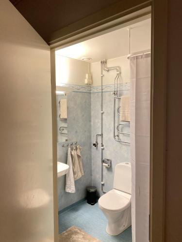 a bathroom with a toilet and a sink and a shower at Superb Appartement in Kallhäll in Stockholm