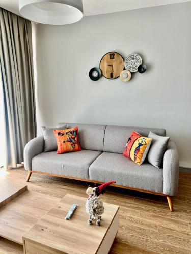 a living room with a couch and a table at Elegant Residence Famagusta in Famagusta