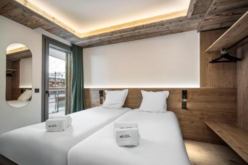 Chalet Hôtel Quartzにあるベッド