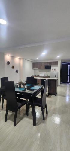 a dining room with a table and some chairs at Molina House Sandona in Sandoná