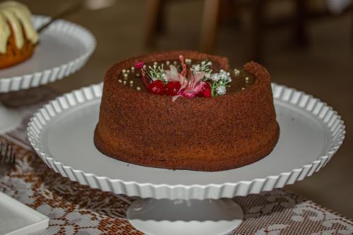 a chocolate cake on a plate on a table at Pousada Natureza in Morro de São Paulo