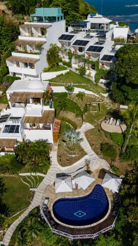 an aerial view of a resort with a swimming pool at Pousada Natureza in Morro de São Paulo
