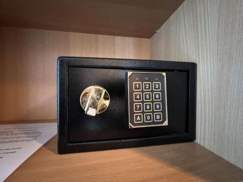 a digital clock on a table in a room at Holiday Home Wallner by Interhome in Fusch an der Glocknerstraße