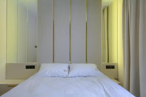 Ένα ή περισσότερα κρεβάτια σε δωμάτιο στο MK Premium Apartamenty