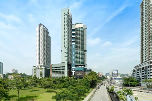 a city skyline with tall buildings and a highway at Holiday Inn Kuala Lumpur Bangsar by IHG in Kuala Lumpur