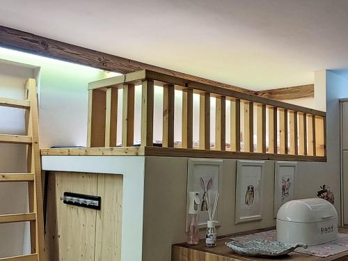 a room with a loft with a staircase and a table at Studio Apart Fassern by Interhome in Fliess