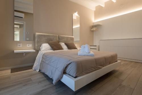 Cama o camas de una habitación en Aurora ApartHotel