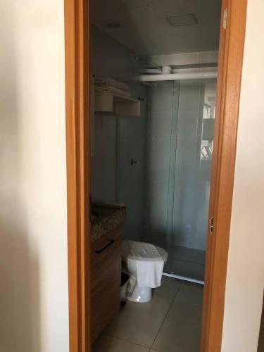 a small bathroom with a toilet and a shower at Gold flat Manaíra 602 in João Pessoa