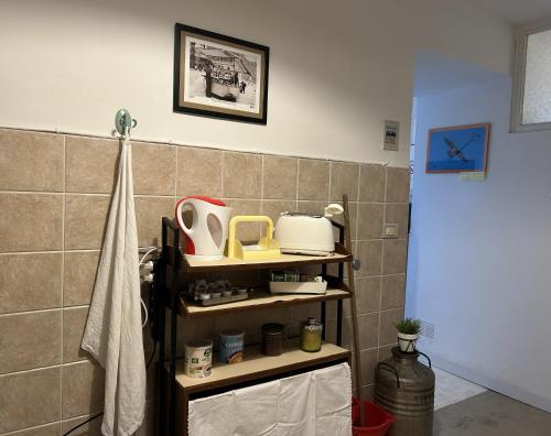 a bathroom with a shelf with items on it at Welcome in Toscana in Polcanto