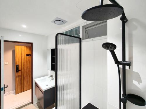 a bathroom with a mirror and a sink in a room at AB House in Bangkok