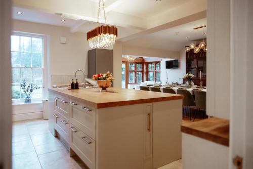 a kitchen with a sink and a counter top at The Manor Lodge, Repton in Repton