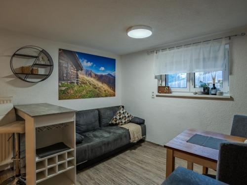 a living room with a couch and a table at Apartment Süta Ötztal by Interhome in Sautens