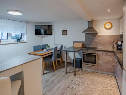 a kitchen with a table and a dining room at Apartment Süta Ötztal by Interhome in Sautens