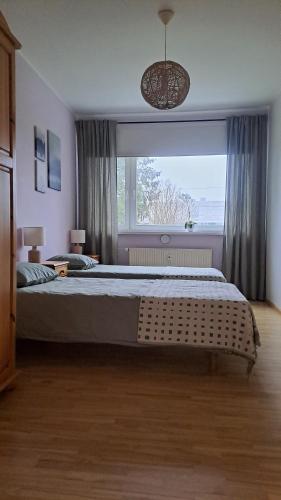 Postel nebo postele na pokoji v ubytování Hubane 3-toaline korter Tallinna piiril Laagris!