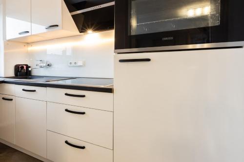 Kuchyň nebo kuchyňský kout v ubytování Appartment 7