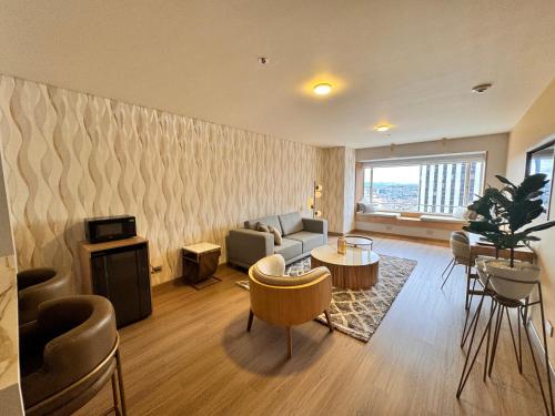 a living room with a couch and a table at Tequendama Suites Bogota in Bogotá