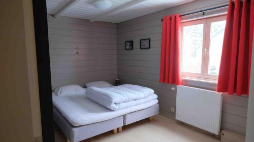 Ένα ή περισσότερα κρεβάτια σε δωμάτιο στο Chalet Les Deux Ourthes