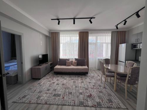 TV a/nebo společenská místnost v ubytování Apartment in Raduga West, Issyk-Kul