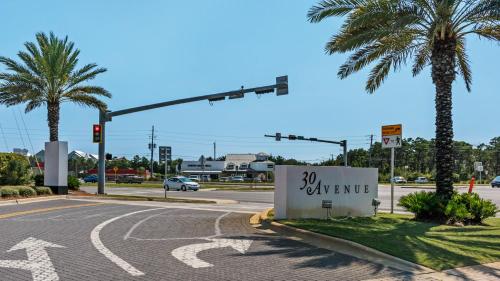 an intersection with a traffic light and a sign that says expensive at Boho Beach House in Inlet Beach