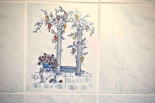 a drawing of three vases with flowers on a wall at Sea Trail in Avegno
